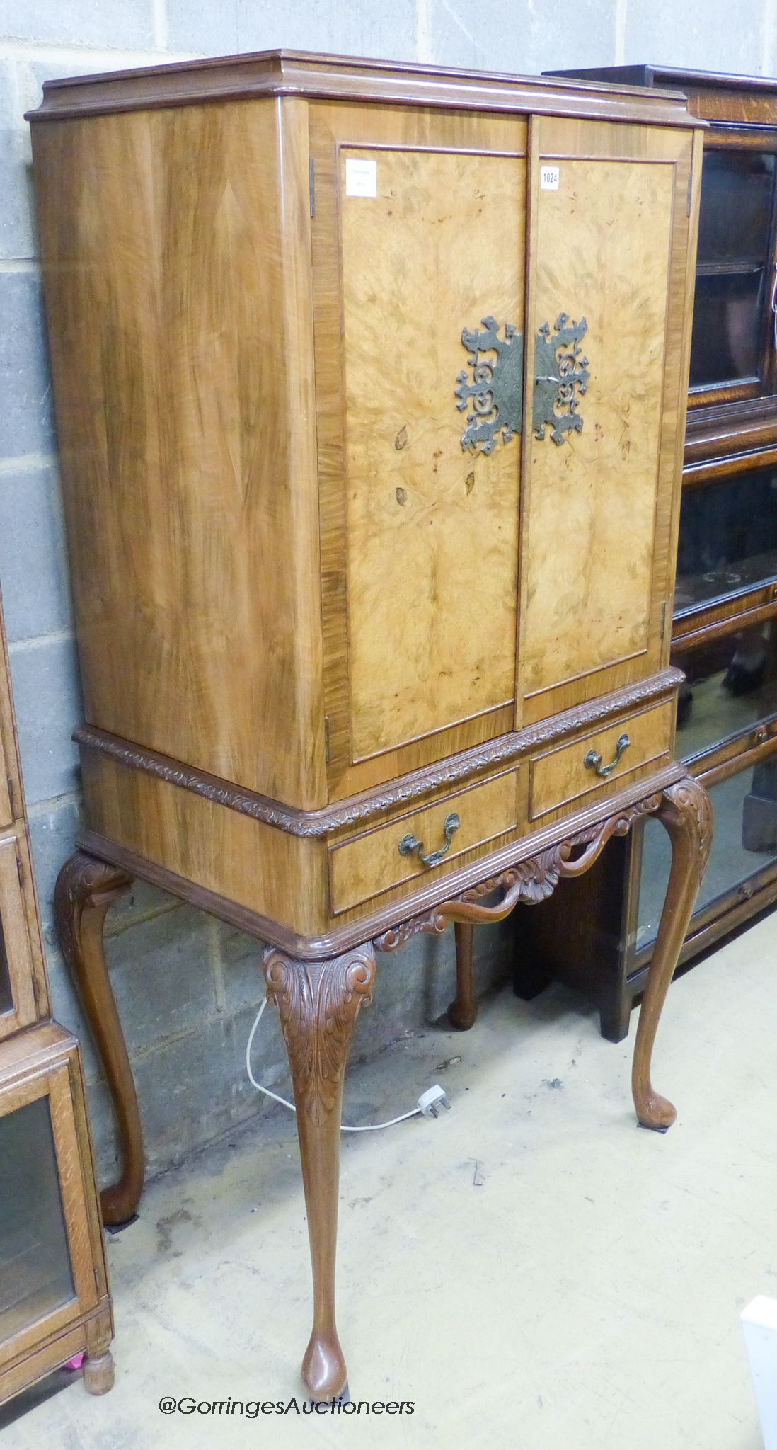 A Queen Anne style brass mounted walnut veneered bar cabinet on stand, width 84cm, depth 53cm, height 156cm